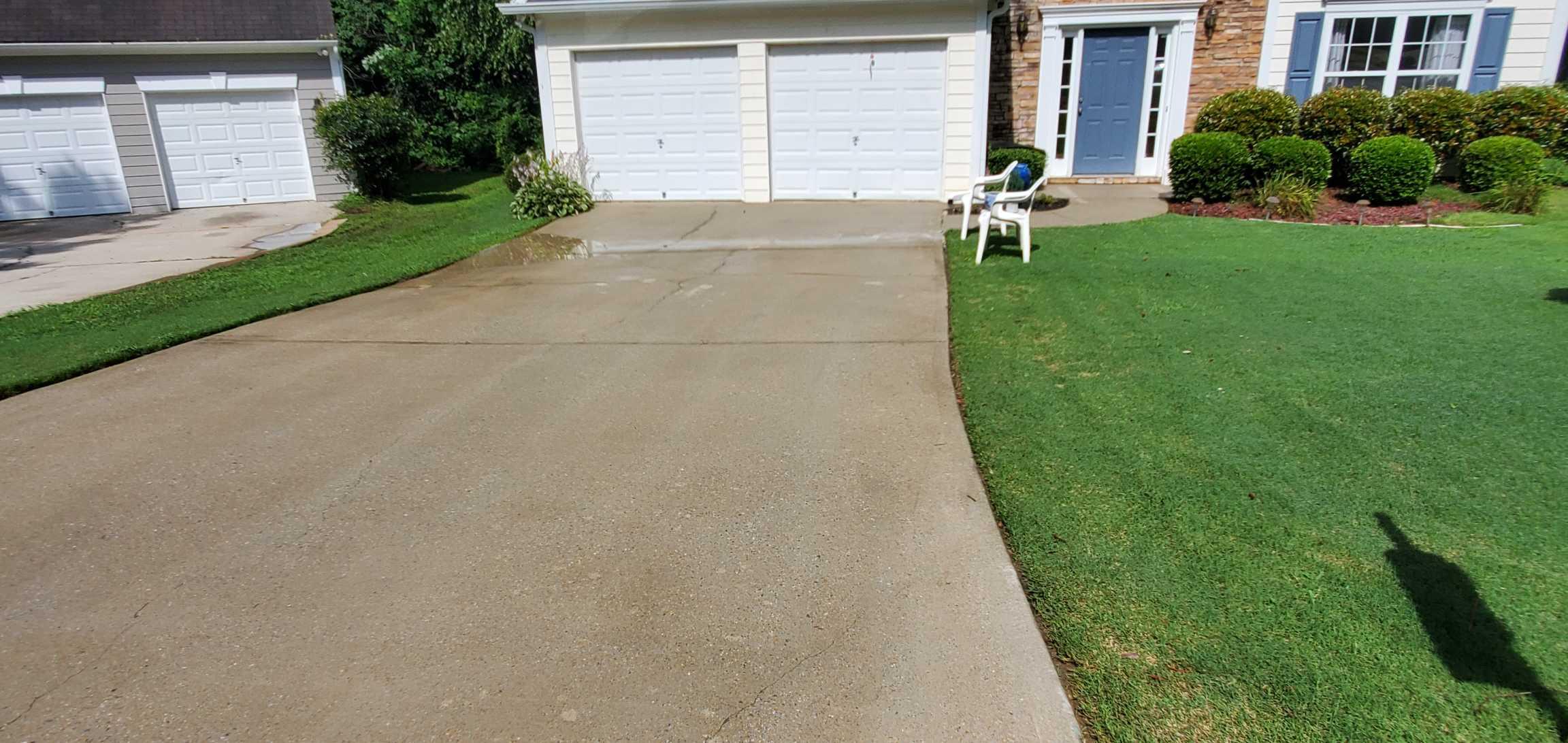 After - Residential driveway pressure washing transformation